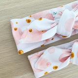 BLUSH BUBBLES PRINT TOP KNOT HEADBAND